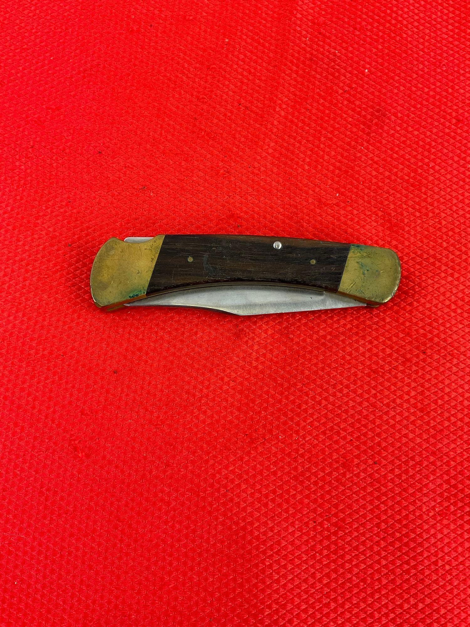 Vintage Buck 3.75" Steel Folding Blade Pocket Knife Model 110 w/ Ebony Handle & Original Sheath. ...