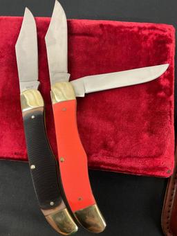 Pair of Schrade NIB Large Trapper Knives, Models 125OT & 25OTO, Black and Orange Handles w/ Sheaths