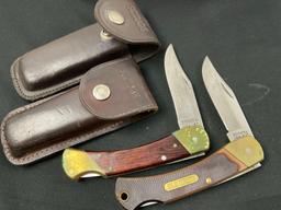 Pair of Schrade Folding Pocket Hunting Single Blade Knives, models 6-OT & LB7 w/ Leather Sheaths