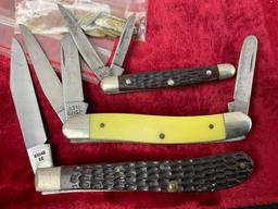 Trio of Case XX Folding Pocket Knives, models 3318 shsp, 6227, 61048 SS, bag of Case Knife emblems