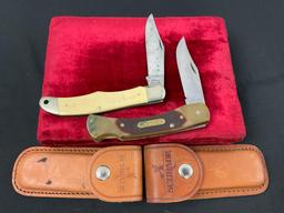Pair of Schrade Folding Pocket Knives, models 7-OT & SC500 Scrimshaw handle w/ Leather Sheaths