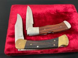 Pair of Buck Folding Hunting Knives, models 110 Hunter & 532 BuckLock, Wooden handles