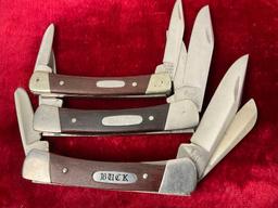 Trio of Buck Multiblade Folding Knives, Model 2x 703 Colt & 709 Yearling, stainless & wooden hand...