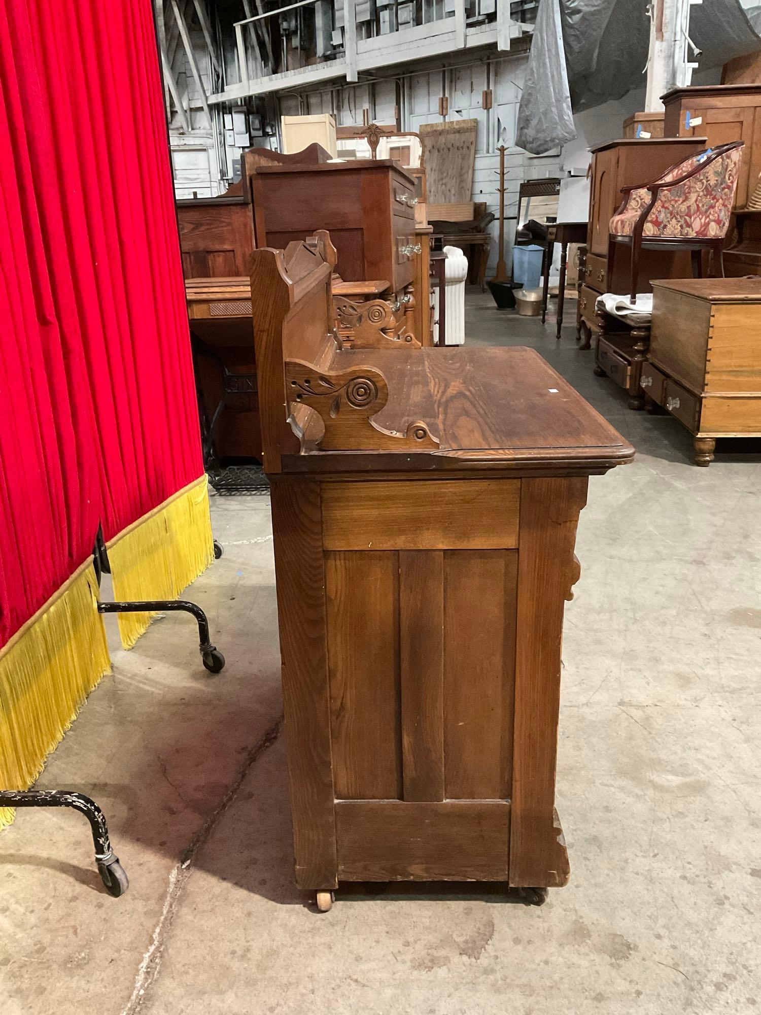 Antique Wheeled Wooden Commode w/ 3 Drawers, 1 Cupboard & Handsome Carved Details. See pics.