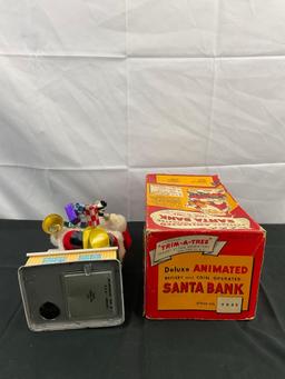 Vintage Noel Decorations Deluxe Animated Battery & Coin Operated Santa Bank. Original Box. See pi...