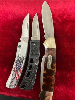 Trio of Buck Folding Knives, models 389 Canoe, 425 MiniBuck, 525 Gentleman w/ Statue of Liberty