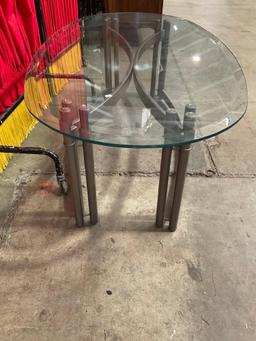 Modern Oval Glass Topped Metal Coffee Table. Measures 50" x 16" See pics.