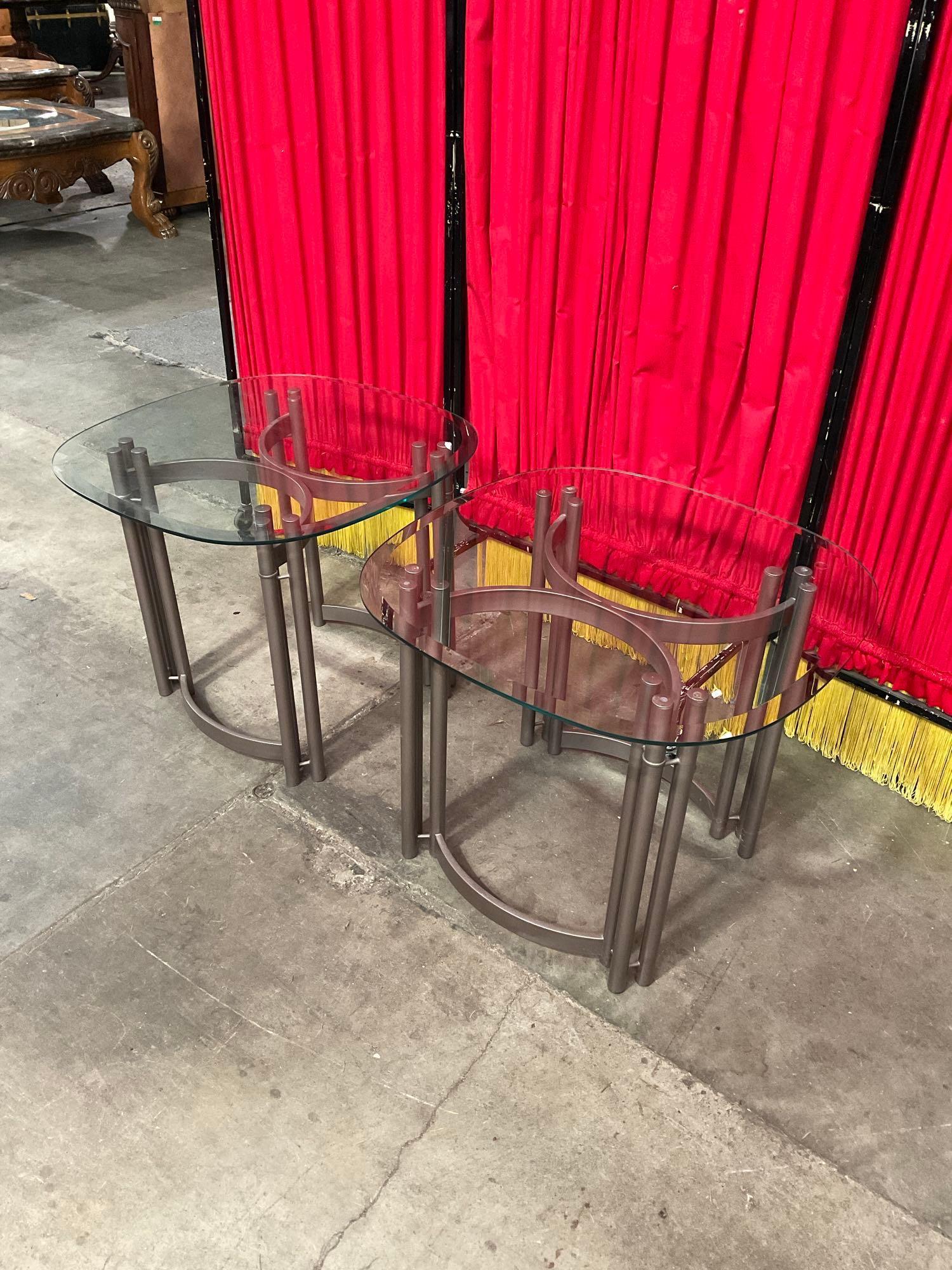 Pair of Modern Glass Topped Metal End Tables. Measures 26" x 21" See pics.