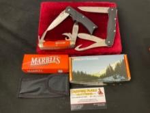 Trio of Knives, Marbles Multitool, Pair of NRA branded folding knives, fishing three blade