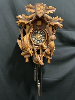 Vintage German Cuckoo Clock MFG Co. w/ Pinecone weights. 14h x 11w x 7.5d inches