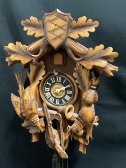 Vintage German Cuckoo Clock MFG Co. w/ Pinecone weights. 14h x 11w x 7.5d inches