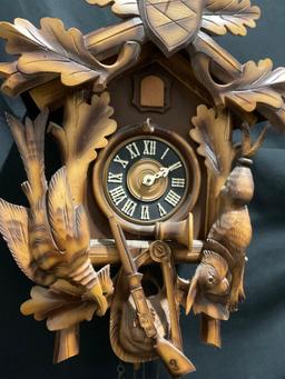 Vintage German Cuckoo Clock MFG Co. w/ Pinecone weights. 14h x 11w x 7.5d inches