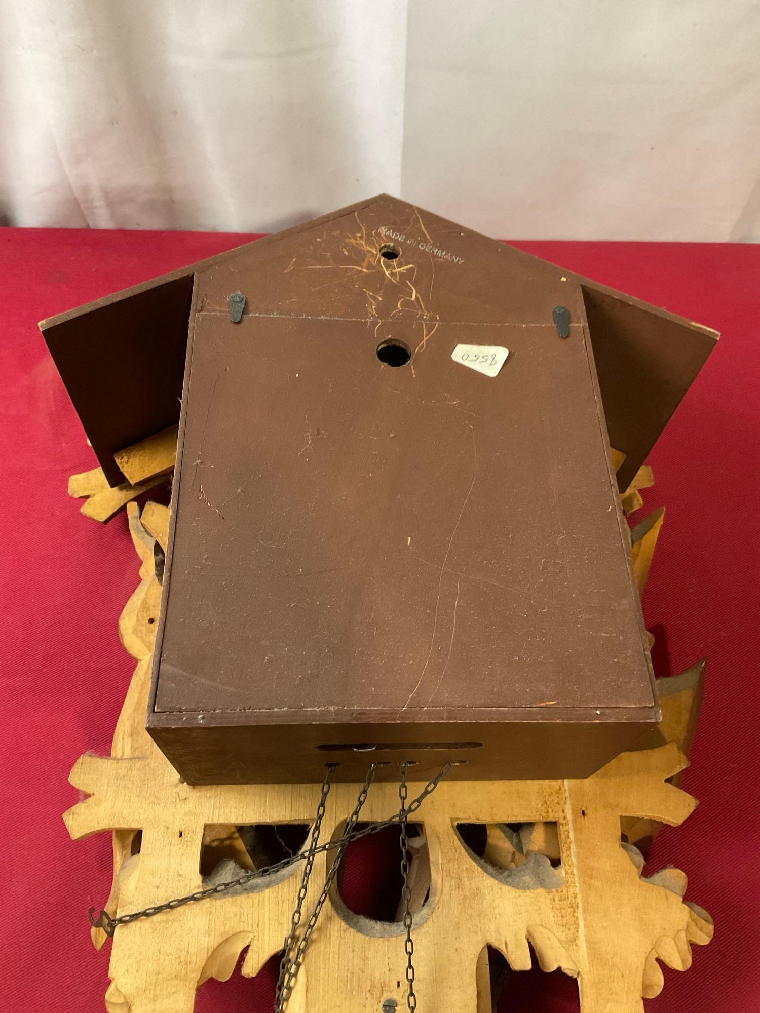 Vintage German Cuckoo Clock MFG Co. w/ Pinecone weights. 14h x 11w x 7.5d inches