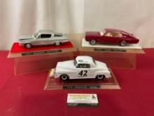 Trio of Model Cars, 1949 & 1965 Plymouth & 1966 Dodge Charger, in display case, 9 inches, 1:24 Sc...