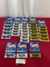 31 Asst. Hot Wheels Diecast Cars in packaging, Dodge Ram 1500, Dodge Sidewinder & Dodge Power Wagon