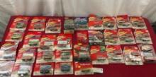 32 Pieces of Johnny Lightning Diecast Cars in packaging, Plymouth, Dodge, Ram, Chrysler