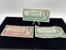 3x 1954 Canadian Notes 2x $1 dollar 1 x $2 dollar, one of the $1 dollar notes appear to be AU 1 f...