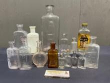 Variety of The Owl Drug Bottles, approx 15 pieces, varied sizes, largest is about 8 x 3 x 2.5 inc...
