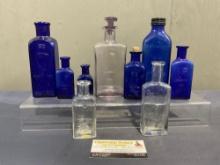 Set of 10 of The Owl Drug Bottles, some marked POISON, one Gilletts Double Extract, Blue & Clear