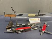 5 Multitools, Schrade Scrimshaw SC506, 2 Red scale handled, 1 marked Port Gamble, 1 Camco