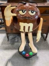 Brown M&M Candy Plastic Store Rolling Display Stand. Good Condition. See pics.