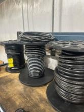 (6) Reels Of New Hydraulic Hose, Assortment of Size With A Steel Rack