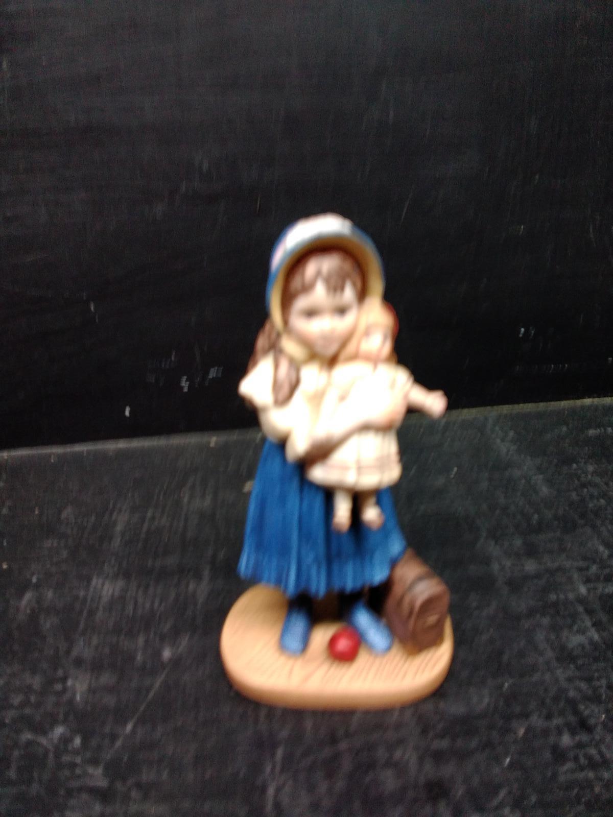 Lisa and the Jumeau Doll Porcelain Figure