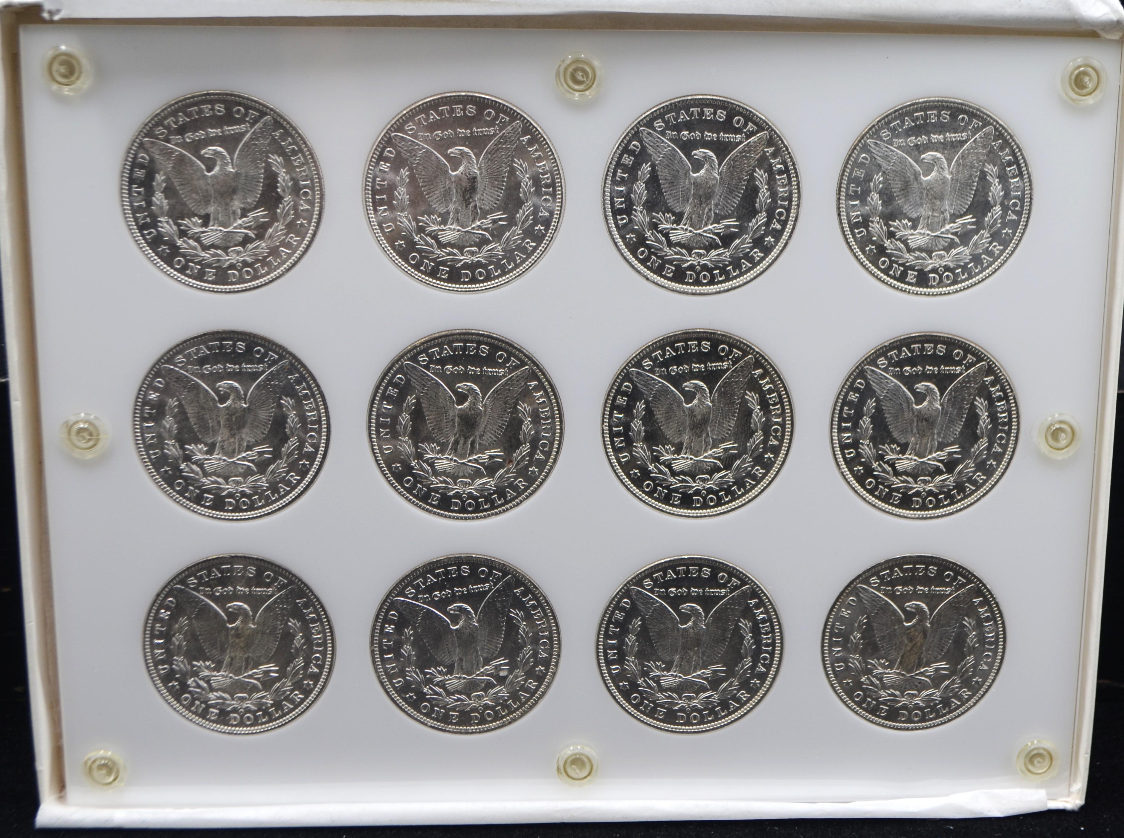 SET OF GEM+ BU MORGAN DOLLARS IN CAPITAL HOLDER