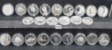 24 $1 SILVER COMMEMORATIVE ROUNDS IN CAPSULES