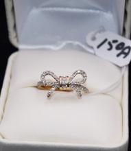14K WHITE GOLD DIAMOND BOW RING.