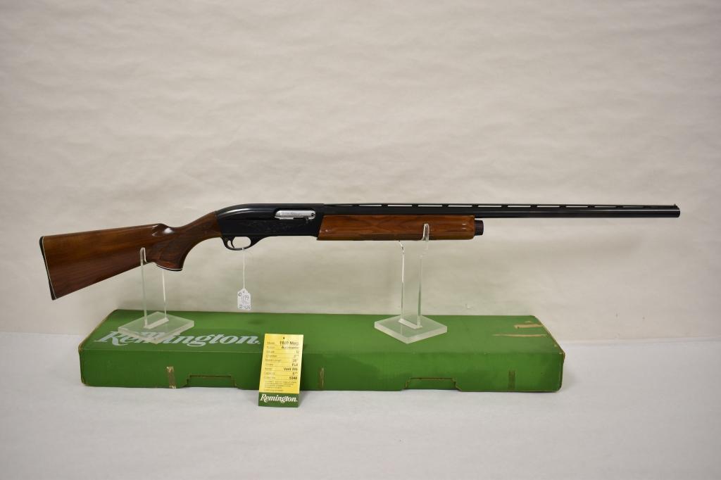 Gun. Remington Model 1100 12 ga Shotgun