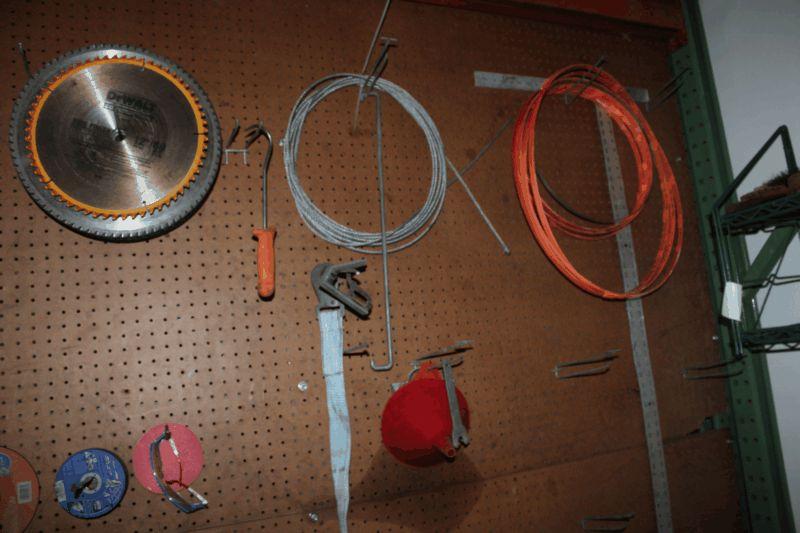 Peg Board Wall of Assorted Cut off Tools