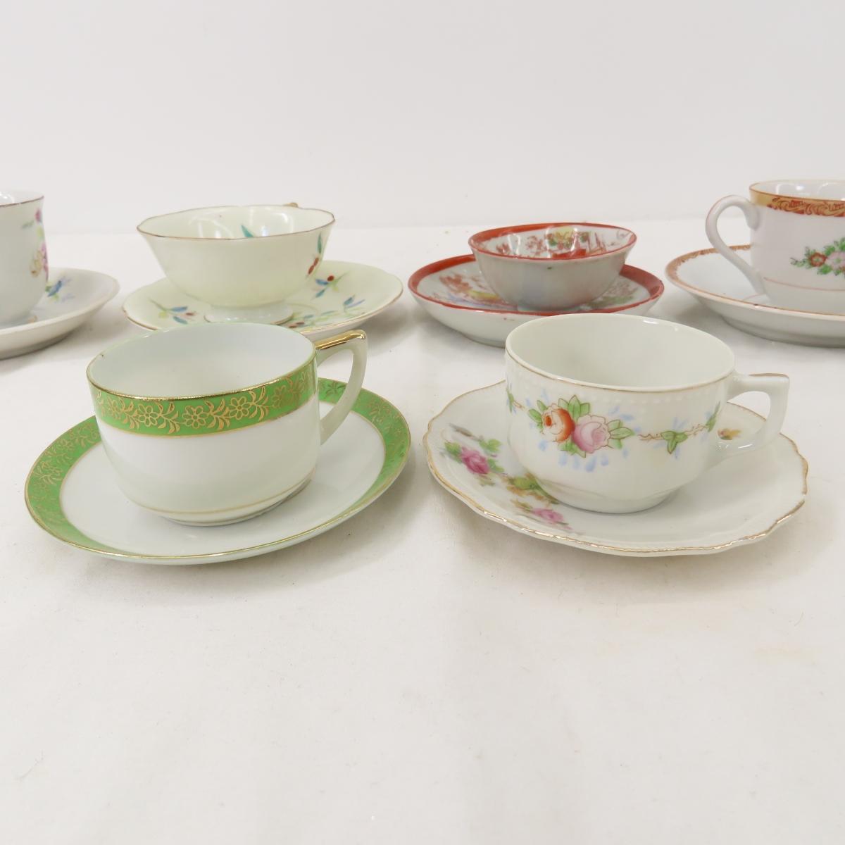 Antique demitasse cups, tea cups and saucers