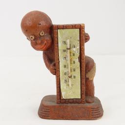 Black Americana figurines, thermometer, shot glass