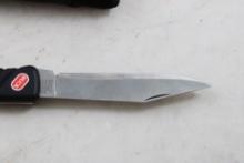 Buck Folding Knife by Wenger Switzerland in Sheath