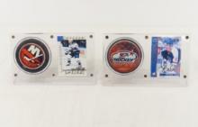 2 Autographed Hockey cards with pucks in displays