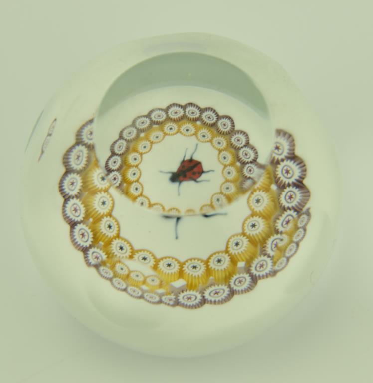 Lot 1247a - (4) Caithness signed art glass paperweights: one titled Starry Nights, and three