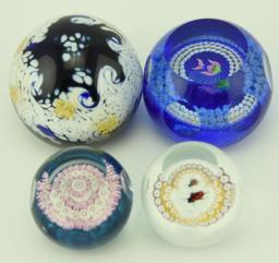 Lot 1247a - (4) Caithness signed art glass paperweights: one titled Starry Nights, and three