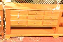 Lot 1379 - Antique pine 9 drawer apothecary cabinet with shelves (100” in width, 30 ½” in height,