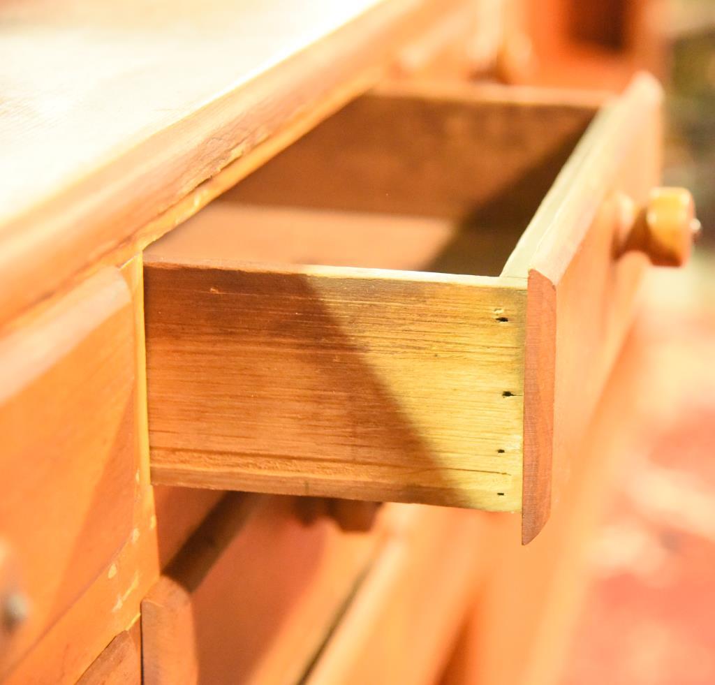 Lot 1379 - Antique pine 9 drawer apothecary cabinet with shelves (100” in width, 30 ½” in height,