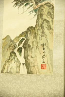Lot 1556 - Oriental scroll with watercolor painting of mountain scene