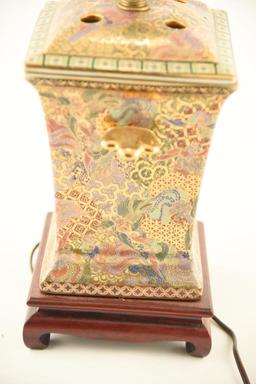 Lot 1557 - Oriental Satsuma style old  painted porcelain lamp with wicker shade (27 ½” in height)