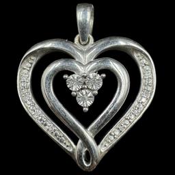 Estate sterling silver diamond pendant