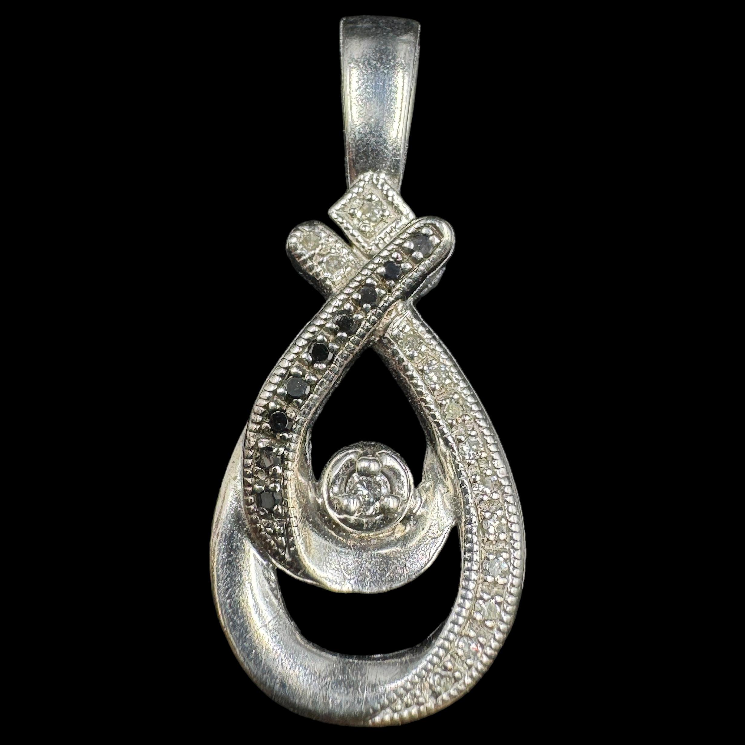 Estate sterling silver diamond pendant