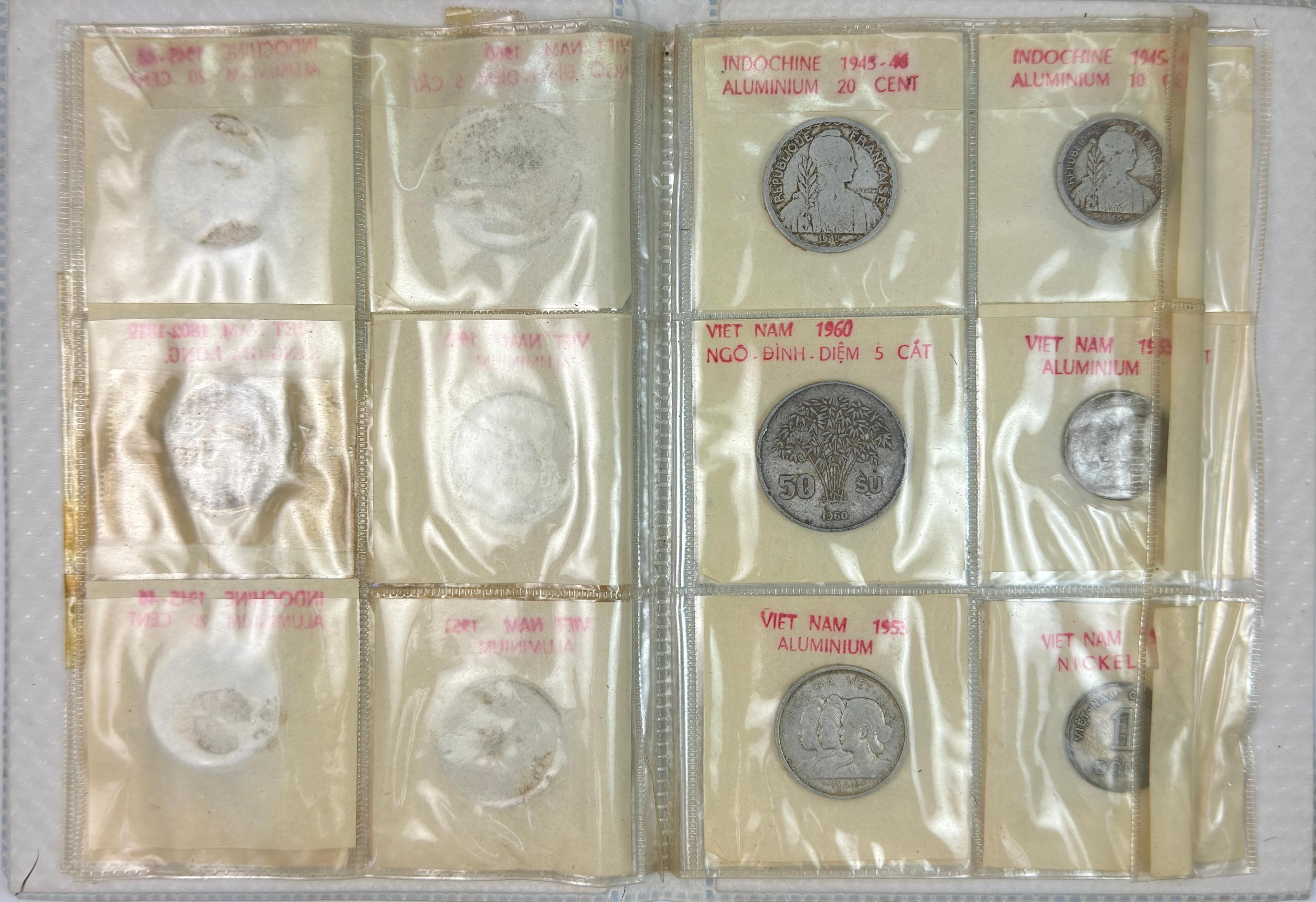 Lot of 2 albums of 23 1940s-1960s Vietnam (Annam) coins