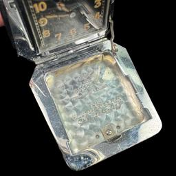 Circa 1936 Swiss Eterna travel clock in a hinged lizard skin