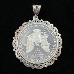 Proof 1999-P American Eagle silver dollar in a sterling silver bezel