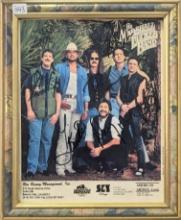 8X10 PHOTO SIGNED BY THE MARSHALL TUCKER BAND FRAME IS IN POOR COND. PHOTO IN FAIR CONDITION
