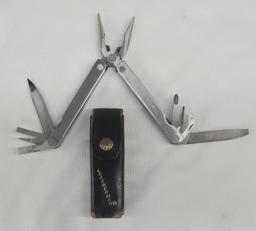 LEATHERMAN MULTITOOL AND VINTAGE LEATHER CARRYING CASE