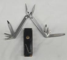 LEATHERMAN MULTITOOL AND VINTAGE LEATHER CARRYING CASE